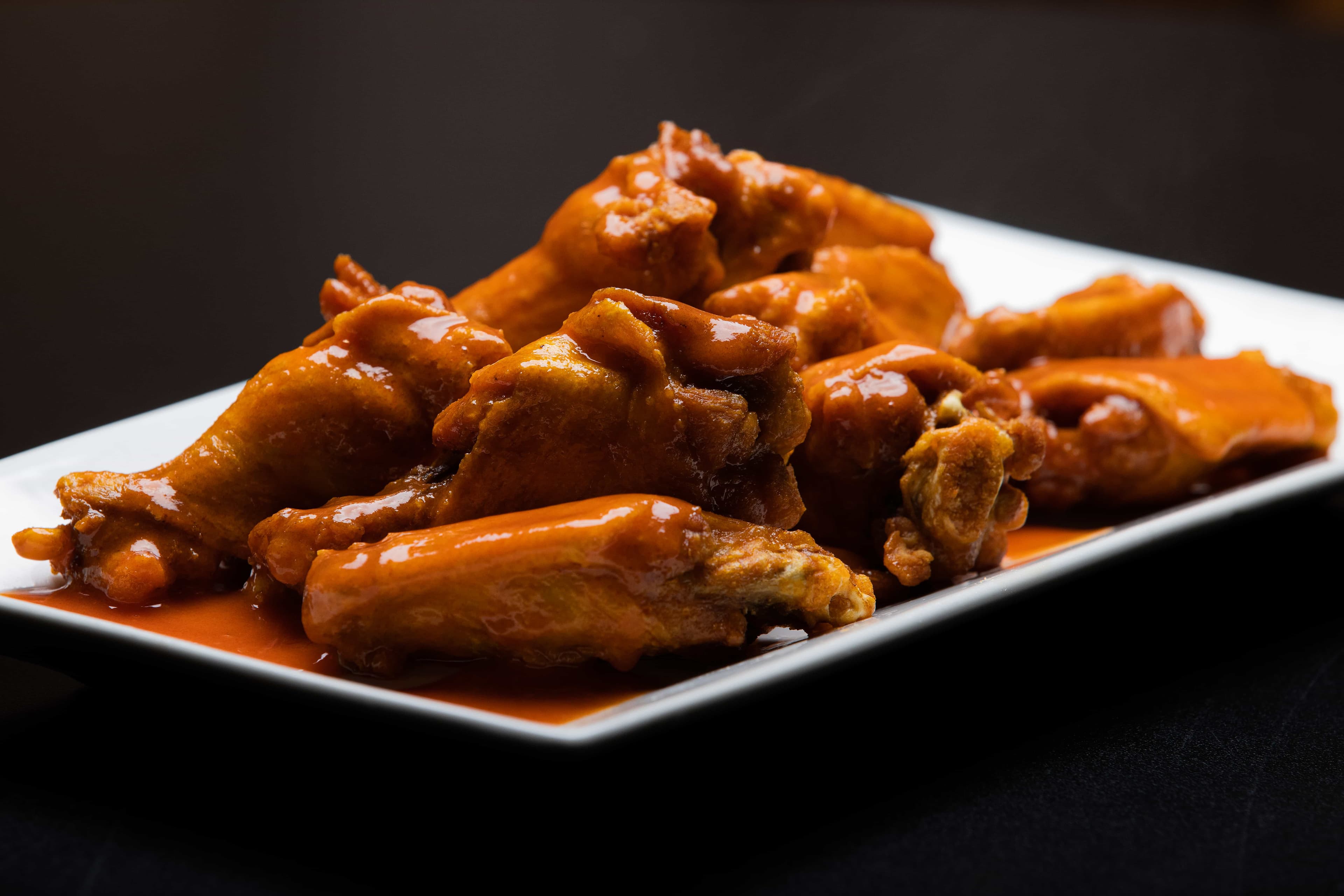 Crispy chicken wings with signature sauce